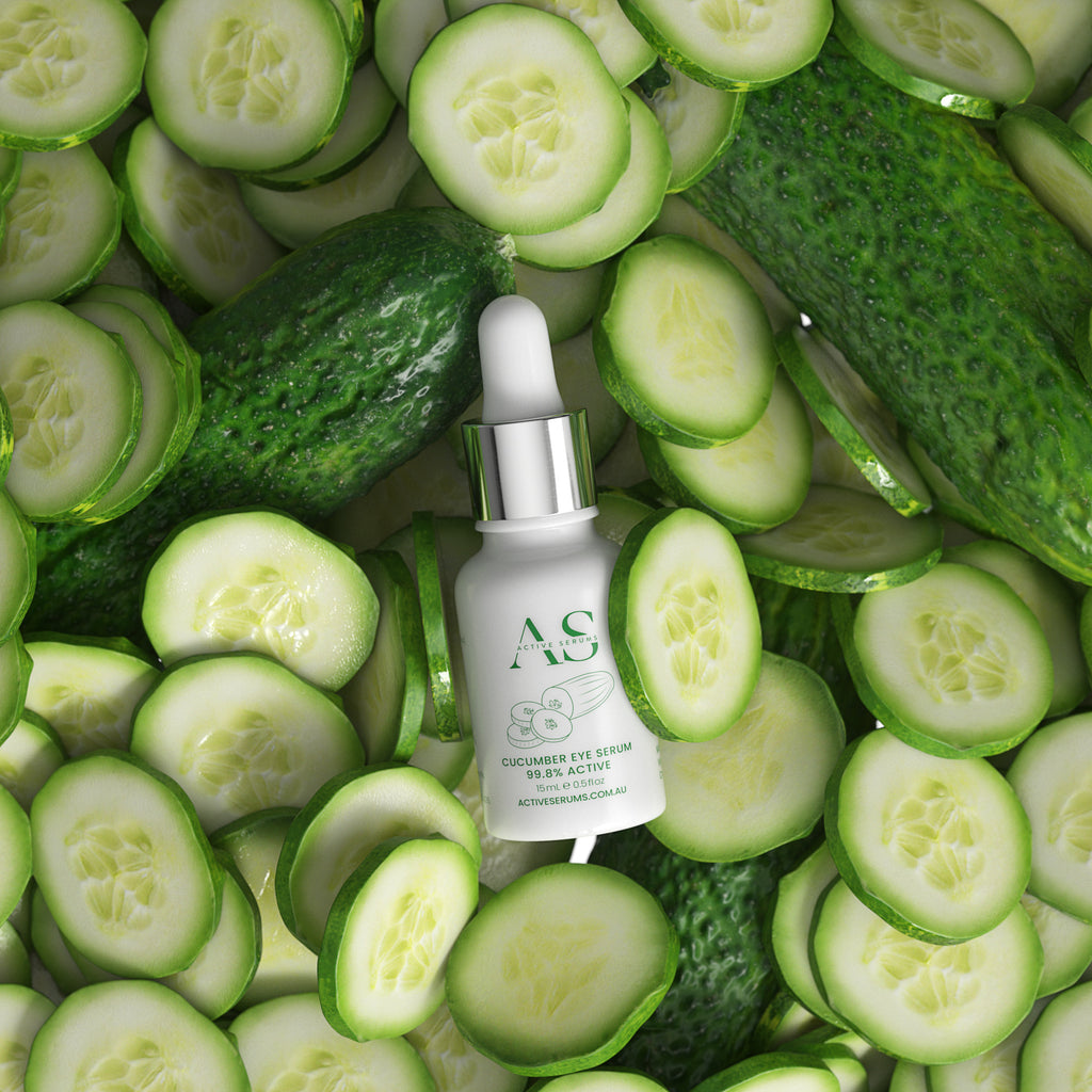 Active Serums 15ml Cucumber Eye Serum bottle nestled in a flatlay of freshly sliced cucumbers for dark circles and puffiness.