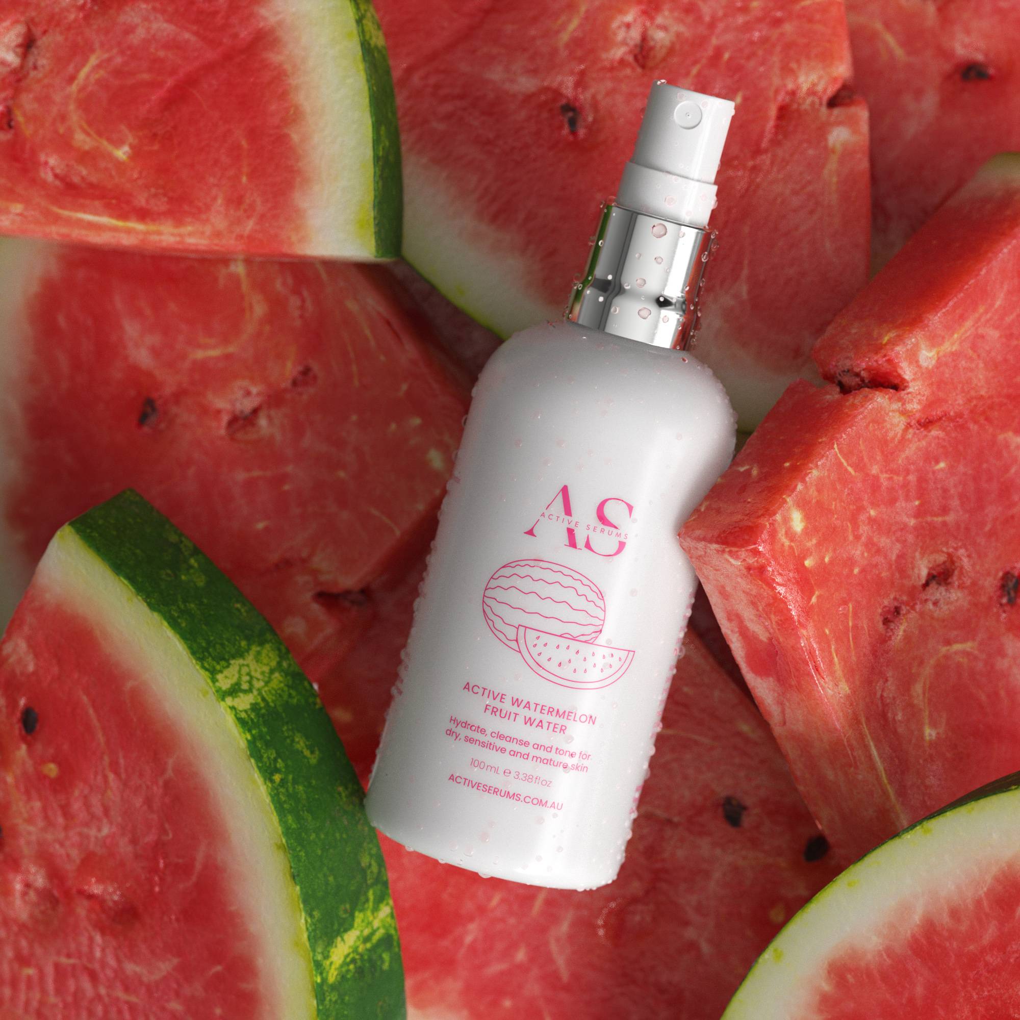 Active Serums watermelon fruit water bottle with fresh watermelon slices, skincare product