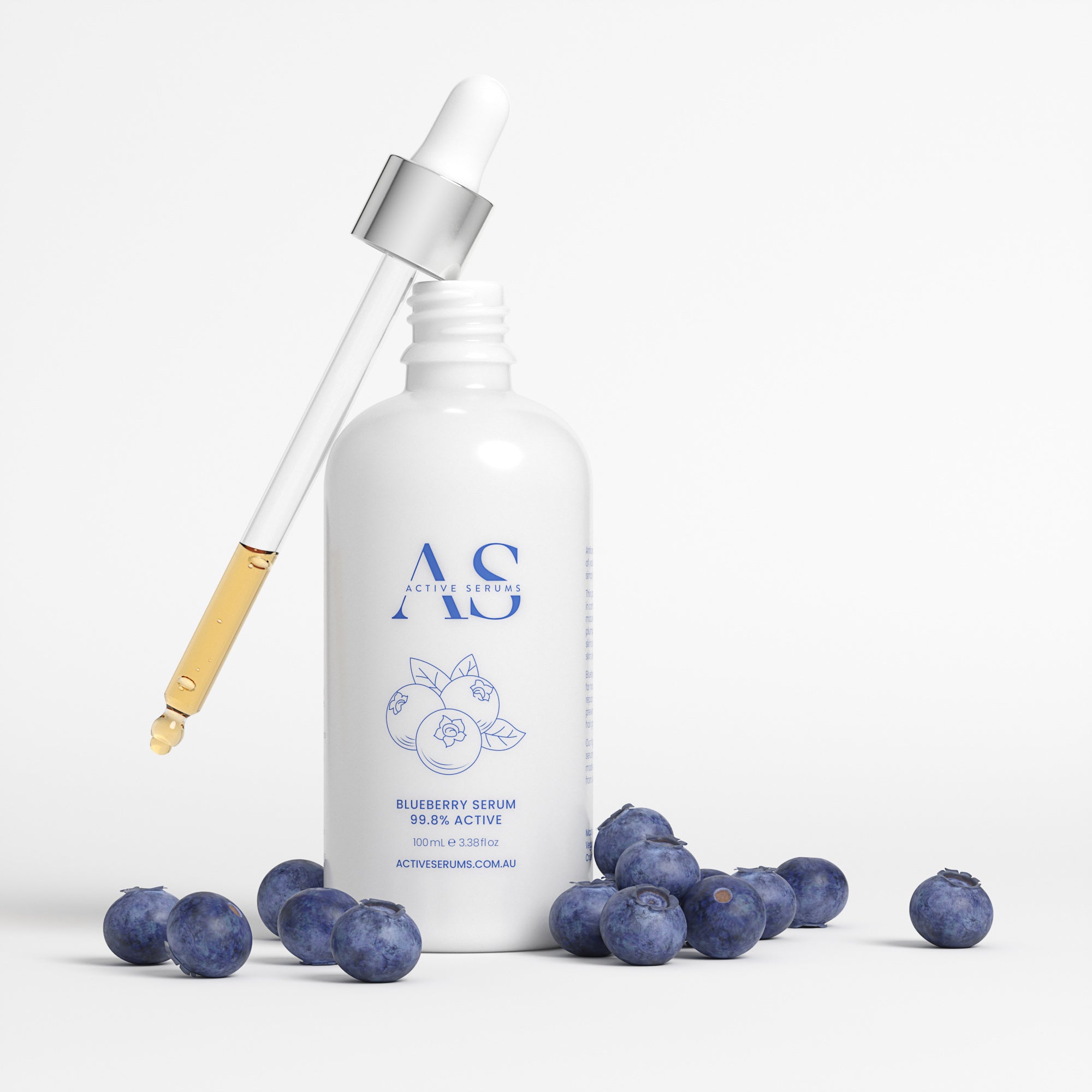 Active Serums 100ml Blueberry Serum: Large white bottle with glass dropper and fresh blueberries to nourish and protect skin.