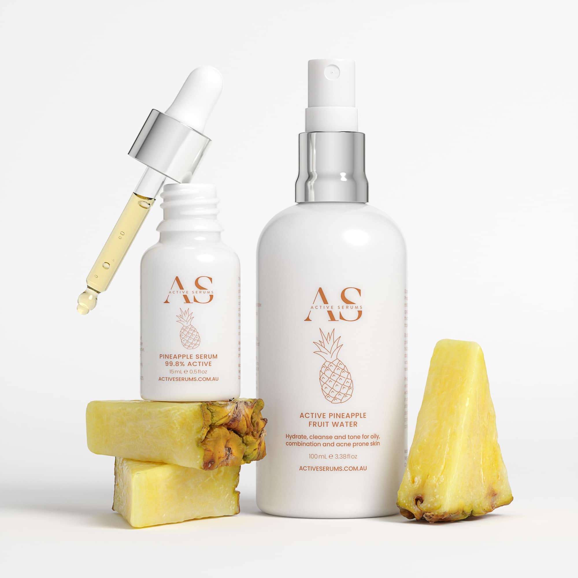 Active Serums pineapple serum and fruit water bottles with fresh pineapple pieces