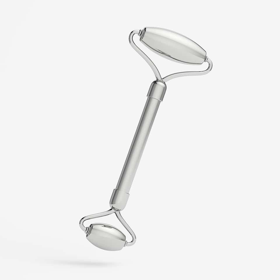 Stainless steel face roller for skincare, ideal with Active Serums for radiant skin