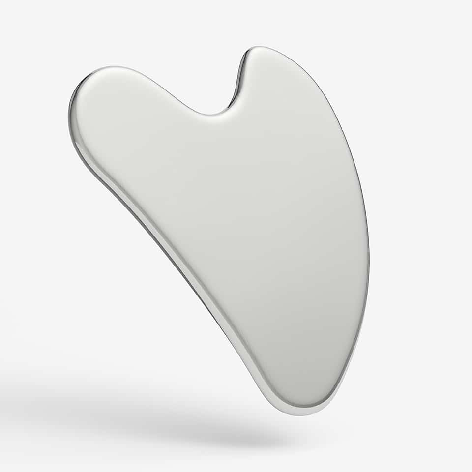 Sleek gua sha facial massage tool on white background, ideal for skincare with Active Serums.