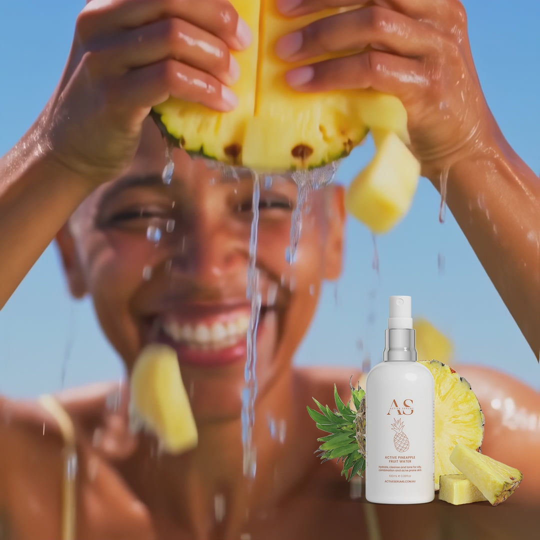 Refreshing splash of Active Pineapple Fruit Water with a smiling woman and fresh fruit slices.